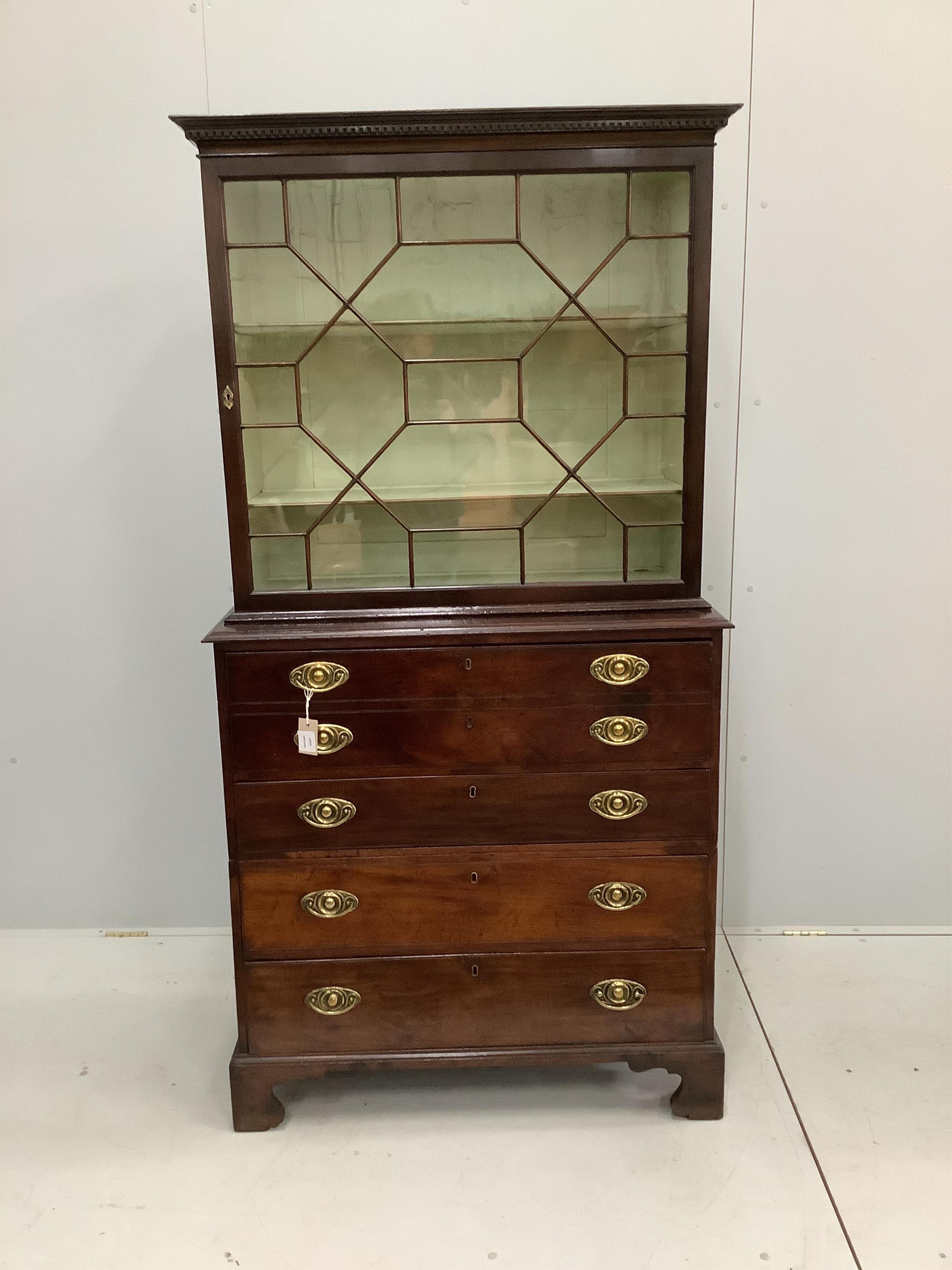 A George III mahogany secretaire chest, later bookcase top, width 94cm, depth 47cm, height 182cm. Condition - good